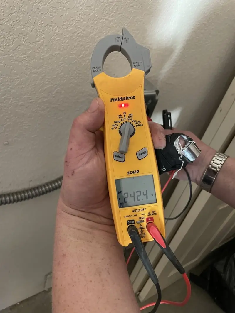 Voltage testing with clamp meter during Circuit Breaker Repair in West New York